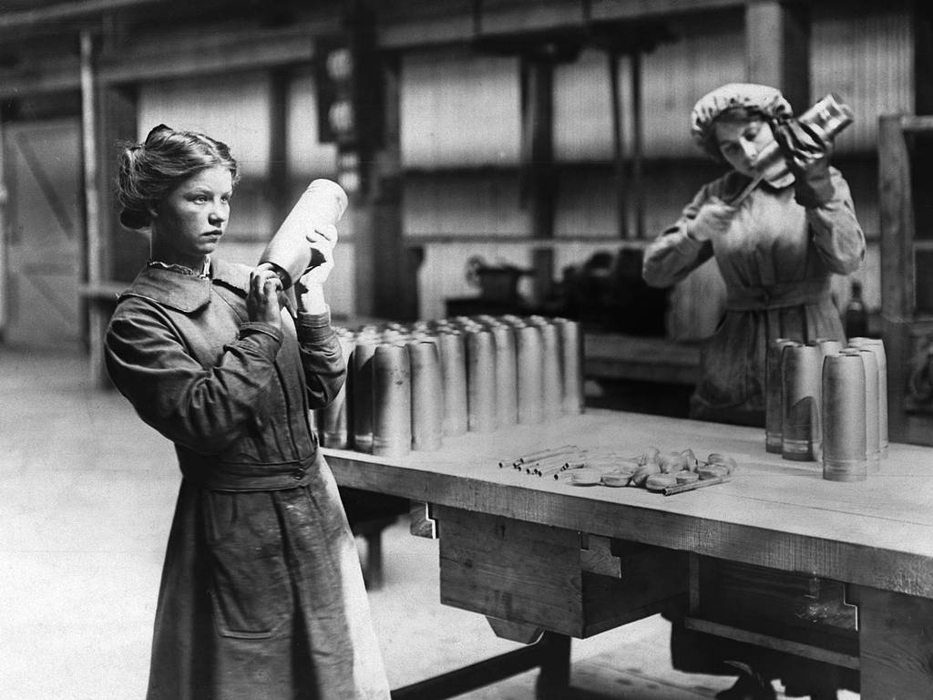 WOMEN WORKING IN A SHELL FACTORY.